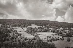 Wonderful wooded mountain alpine panorama with village and huts Austria. photo