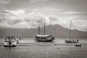 Boats ships and Boat trips Abraao beach Ilha Grande Brazil. photo