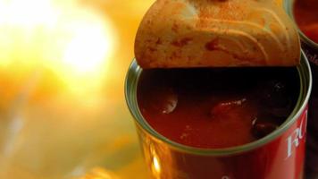 Pour the lightly canned tomatoes over the chorizo ingredients that are frying. Macro shooting video