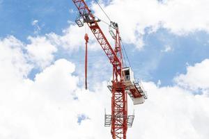 Tower construction crane with blue sky background photo