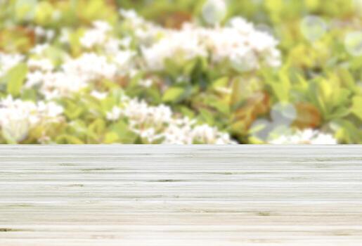 Template empty top table view with white flower and green leaf blur effect background photo