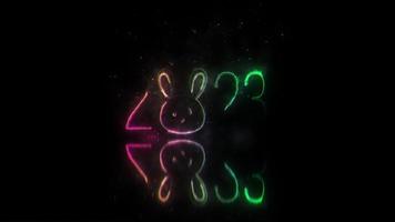 2023 gelukkig nieuw jaar met konijn gezicht neon laser tekst video