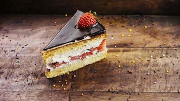 Delicious strawberry cake on a wooden tray with decorations video