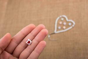Heart shaped object in hand