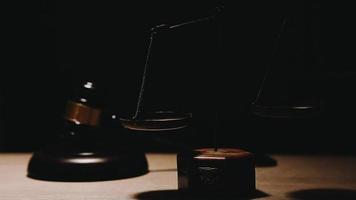 Business and lawyers discussing contract papers with brass scale on desk in office. Law, legal services, advice, justice and law video