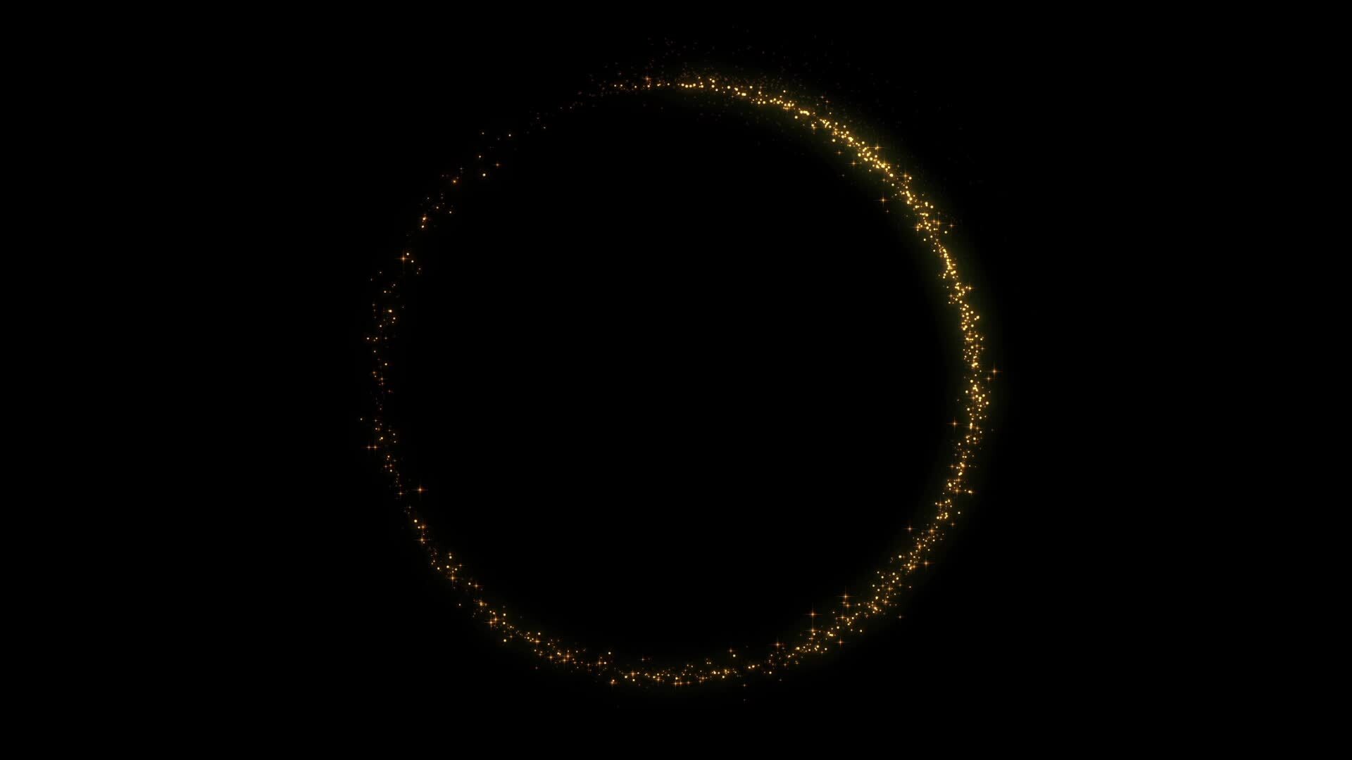 Gold dust in the form of a closing circle on a black background