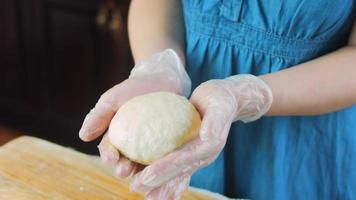 The chef spreads the green dough with a rolling pin. Tortillas prepared and decorated with spinach and beets. Red and green tortillas video