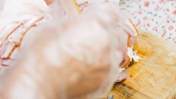 The chef puts the sausage slicers with food tongs video