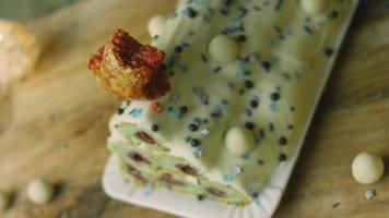 Cake with green dough, sour cherries and sour cream. It also has food ornament and the red star cake video