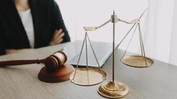 Justice and law concept.Male judge in a courtroom with the gavel, working with, computer and docking keyboard, eyeglasses, on table in morning light video