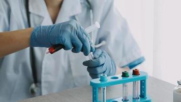 Medical Research Laboratory Portrait of a Female Scientist Wearing Face Mask Using Micro Pipette for Analysis. Advanced Scientific Lab for Medicine, Biotechnology Development.  Shot video