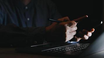 Businessman working with smart phone and laptop and digital tablet computer in office with digital marketing media in virtual icon video