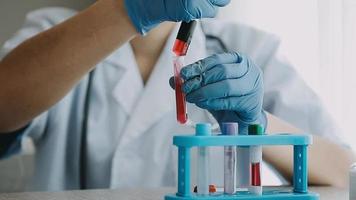 Medical Research Laboratory Portrait of a Female Scientist Wearing Face Mask Using Micro Pipette for Analysis. Advanced Scientific Lab for Medicine, Biotechnology Development.  Shot video