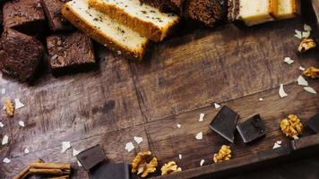 Different kinds of cakes arranged on a wooden tray video