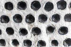 Decorative white walls with bottles set in concrete Holbox Mexico. photo