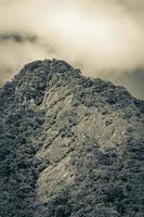 Abraao mountain Pico do Papagaio with clouds. Ilha Grande Brazil. photo