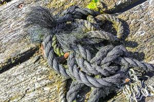 Boat ropes stretched on bollard in Germany. photo