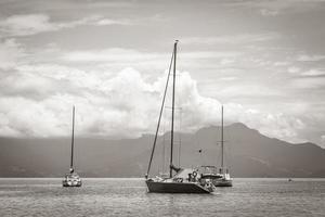 Boats ships and Boat trips Abraao beach Ilha Grande Brazil. photo