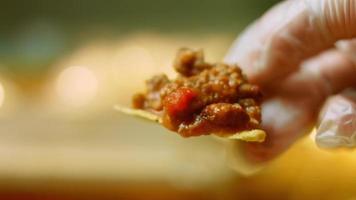 Chili con carnet with nachos. Made from turkey with Belgian beer. Macro shooting video