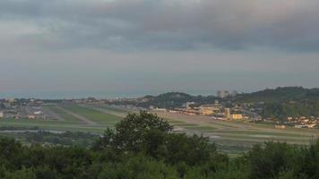 Timelapse of an airport, traffic. Clouds float beautifully over the city. Panoramic view of the runway video