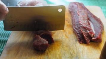 Beef marinated in soy sauce in plastic wrap on a retro tray. Macro shooting. There are air bubbles video