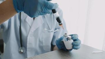 Medical Research Laboratory Portrait of a Female Scientist Wearing Face Mask Using Micro Pipette for Analysis. Advanced Scientific Lab for Medicine, Biotechnology Development.  Shot video