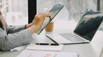 Businessman working with smart phone and laptop and digital tablet computer in office with digital marketing video