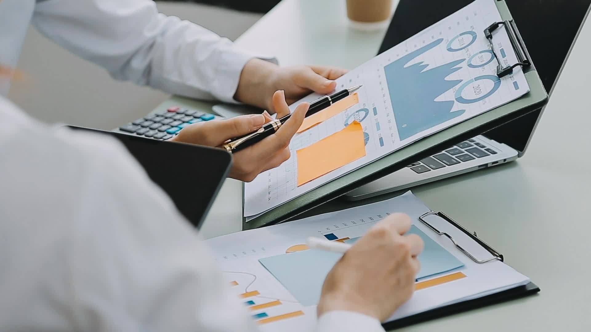 Business people using tablets And using his finger to touch the screen