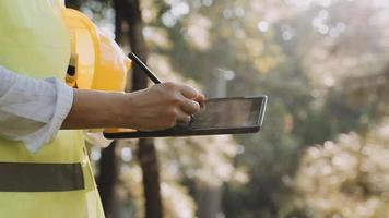 Construction engineer working at blueprint to build large commercial buildings in office. Engineering tools and construction concept video