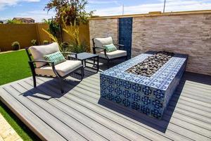 Two Arm Chairs And Table By Ceramic Tile Fire Pit photo