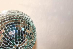 Reflecting disco ball on white background in Germany. photo