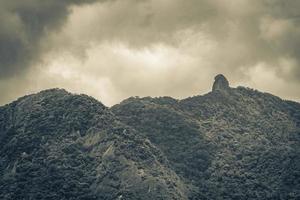 Abraao mountain Pico do Papagaio with clouds Ilha Grande Brazil. photo