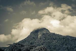 Abraao mountain Pico do Papagaio with clouds. Ilha Grande Brazil. photo