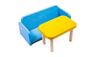 a wooden blue toy chair, a sofa, two chairs with a table, a yellow table, blue upholstered wooden chairs. yellow lamp on isolated white background photo