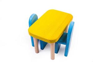 a wooden blue toy chair, a sofa, two chairs with a table, a yellow table, blue upholstered wooden chairs. yellow lamp on isolated white background photo