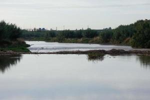 Llobregat river and adjacent roads in the Baix Llobregat region very close to the city of Barcelona. photo