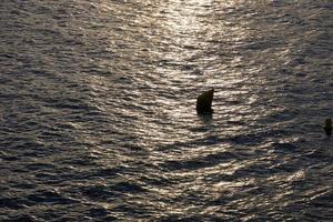 Backlighting of a marine marker buoy photo