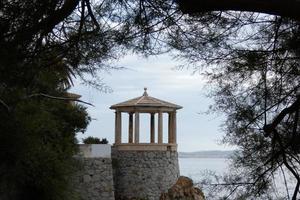 stone gazebo in front of the sea photo