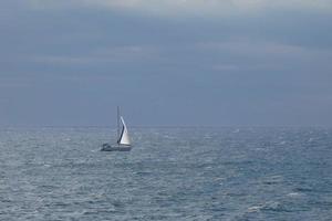 Sailboat sailing in the mediterranean sea, calm waters photo