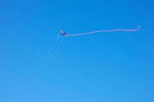 kite furrowing and hovering in the air under the blue sky photo