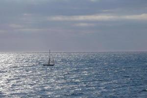 Sailboat sailing in the mediterranean sea, calm waters photo