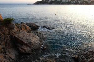 Mediterranean coastline with rocks in the catalan region, Spain photo