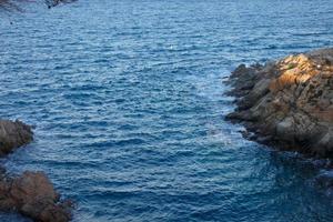 Mediterranean coastline with rocks in the catalan region, Spain photo