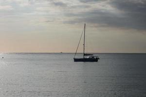 Sailboat sailing in the mediterranean sea, calm waters photo