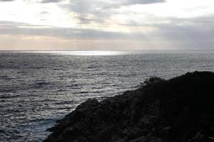 Mediterranean coastline with rocks in the catalan region, Spain photo