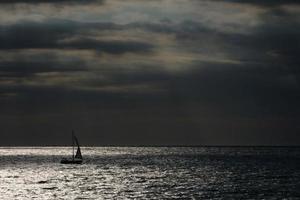 Sailboat sailing in the mediterranean sea, calm waters photo