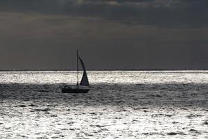 Sailboat sailing in the mediterranean sea, calm waters photo