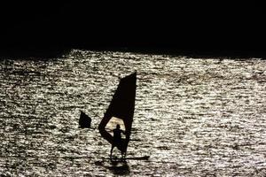 practicing windsurfing in the mediterranean sea, calm sea photo