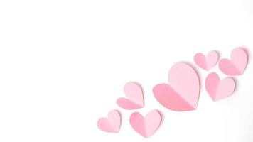 Shape of heart flying on white paper background. photo