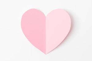 Shape of heart flying on white paper background. photo